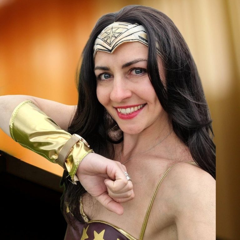 Superhero kids' party A person dressed as Wonder Woman, showing determination with a heroic pose.