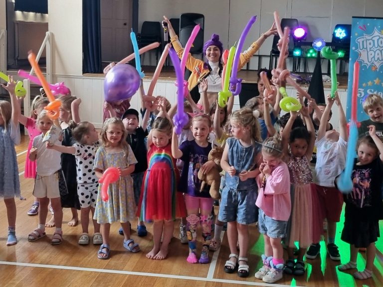 Fun K-pop kids party with music, dancing and games. Female character with purple hair, stylish outfit, and a confident expression.